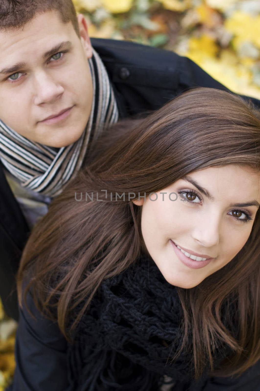 Young couple looking at camera