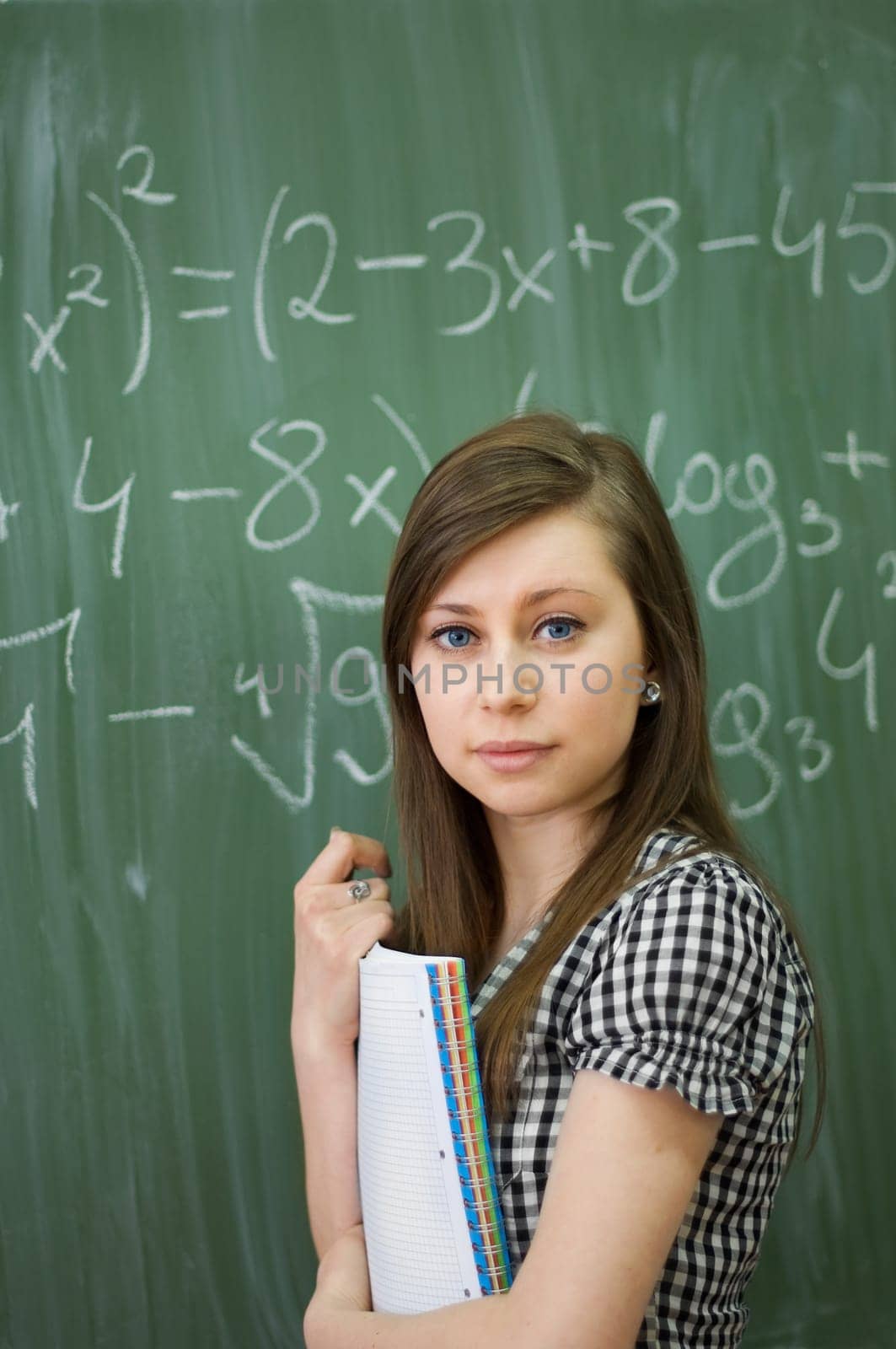 Student girl in looking at camera