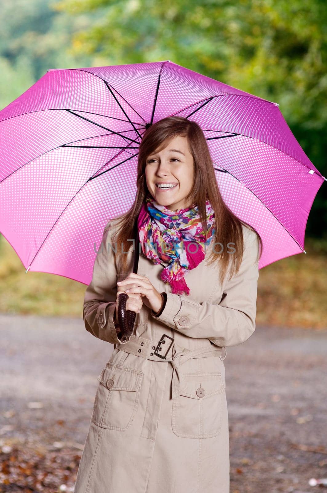 Cute young woman with umbrella