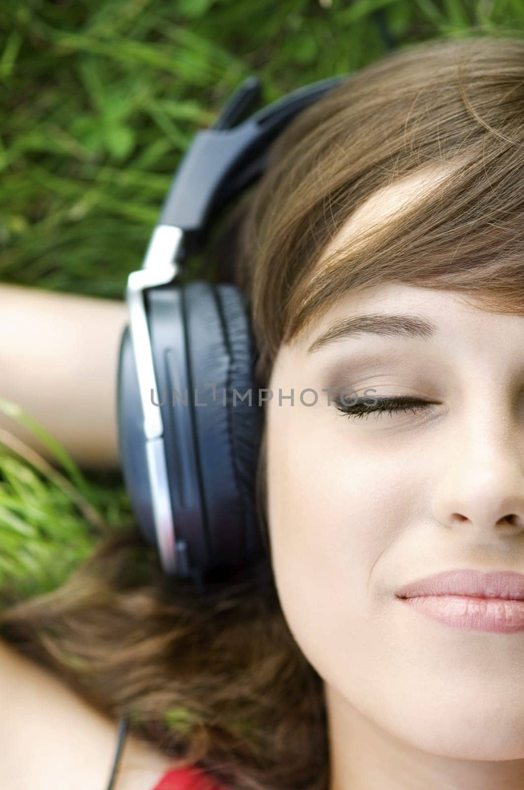 Half portrait of beautiful woman wearing headphones