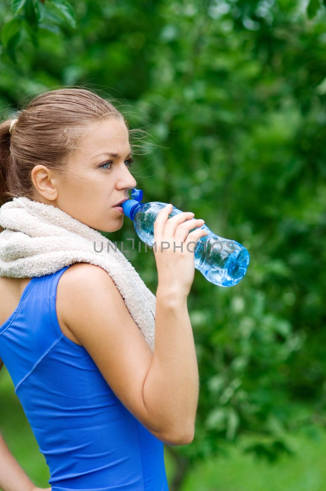 Young woman drinking water