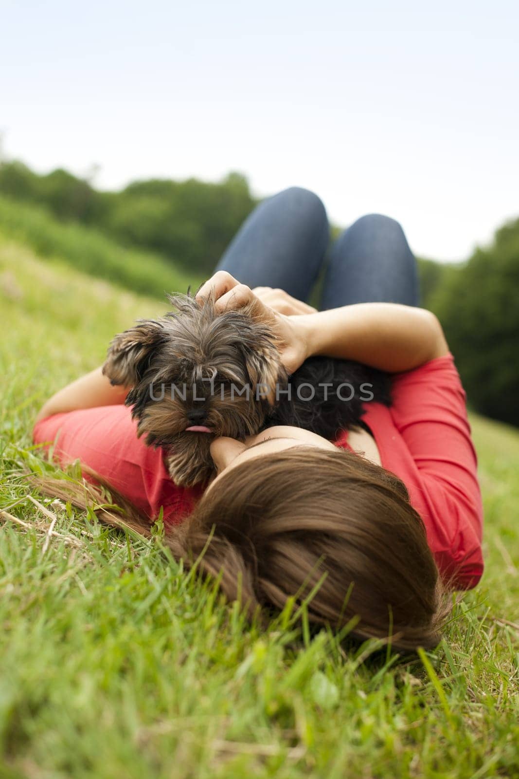 Young woman holding Yorkshire terrier