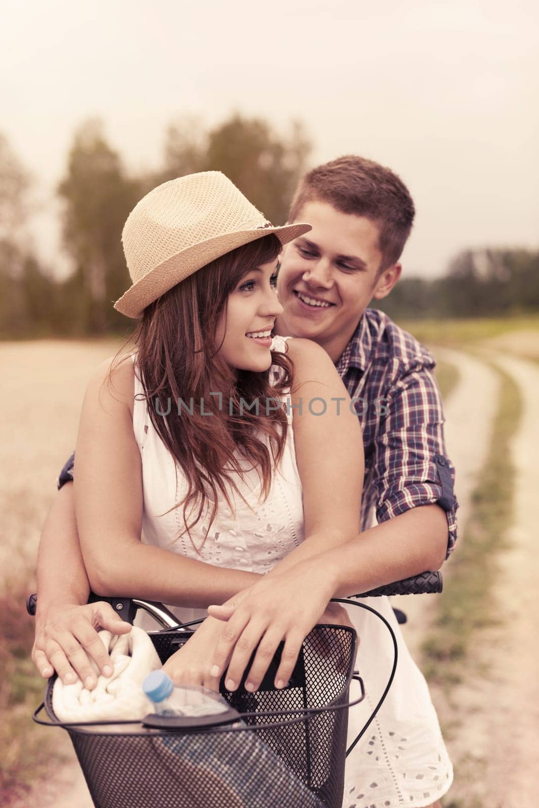 Young couple having fun on bicycle