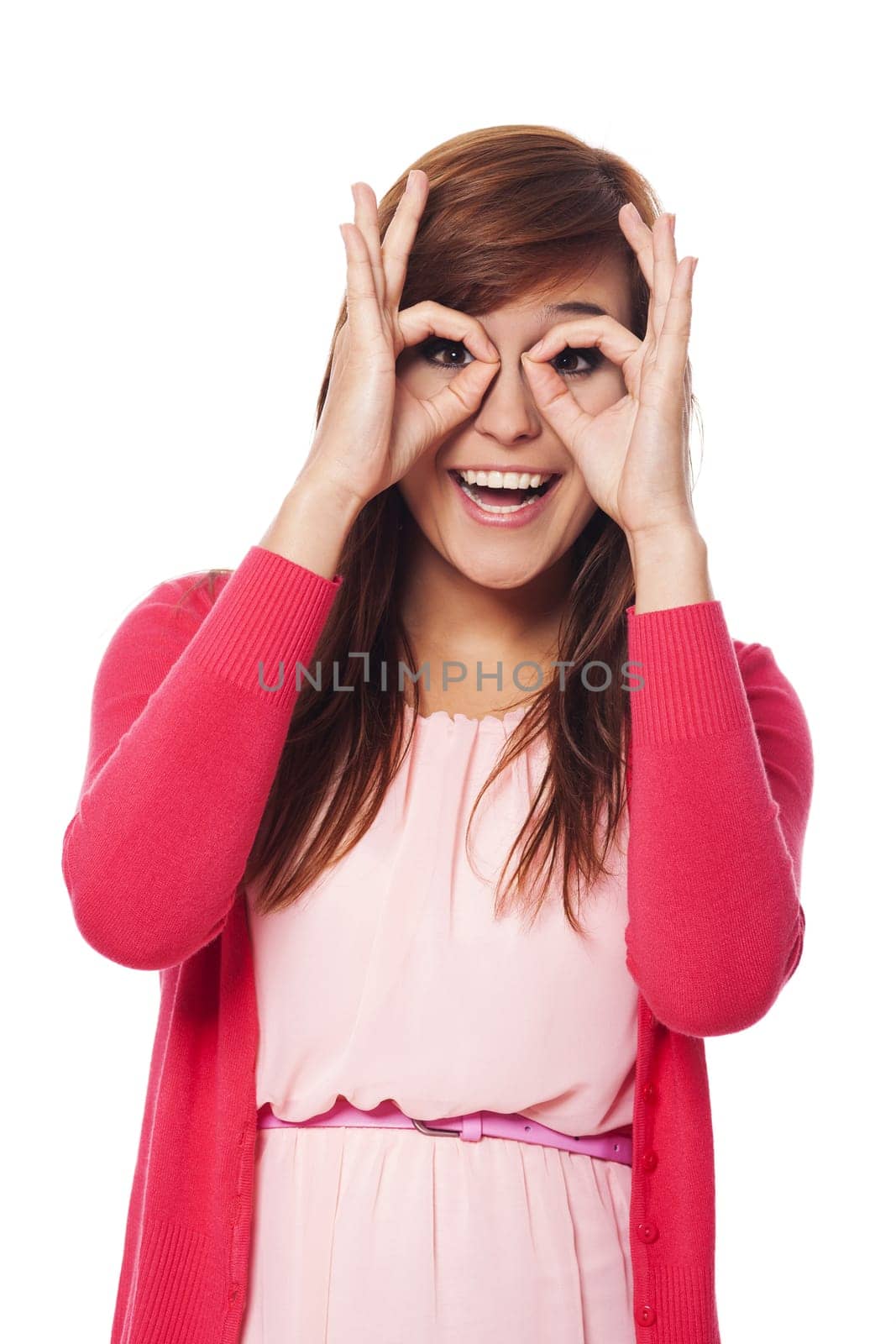 Happy young woman making hand gesture