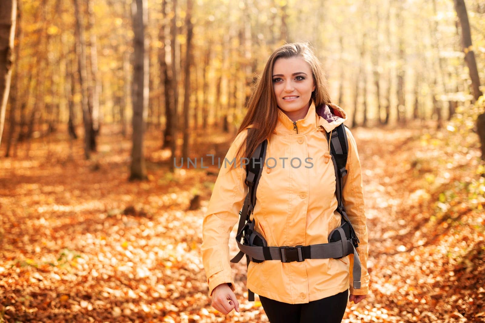 Beautiful female hiker in forest