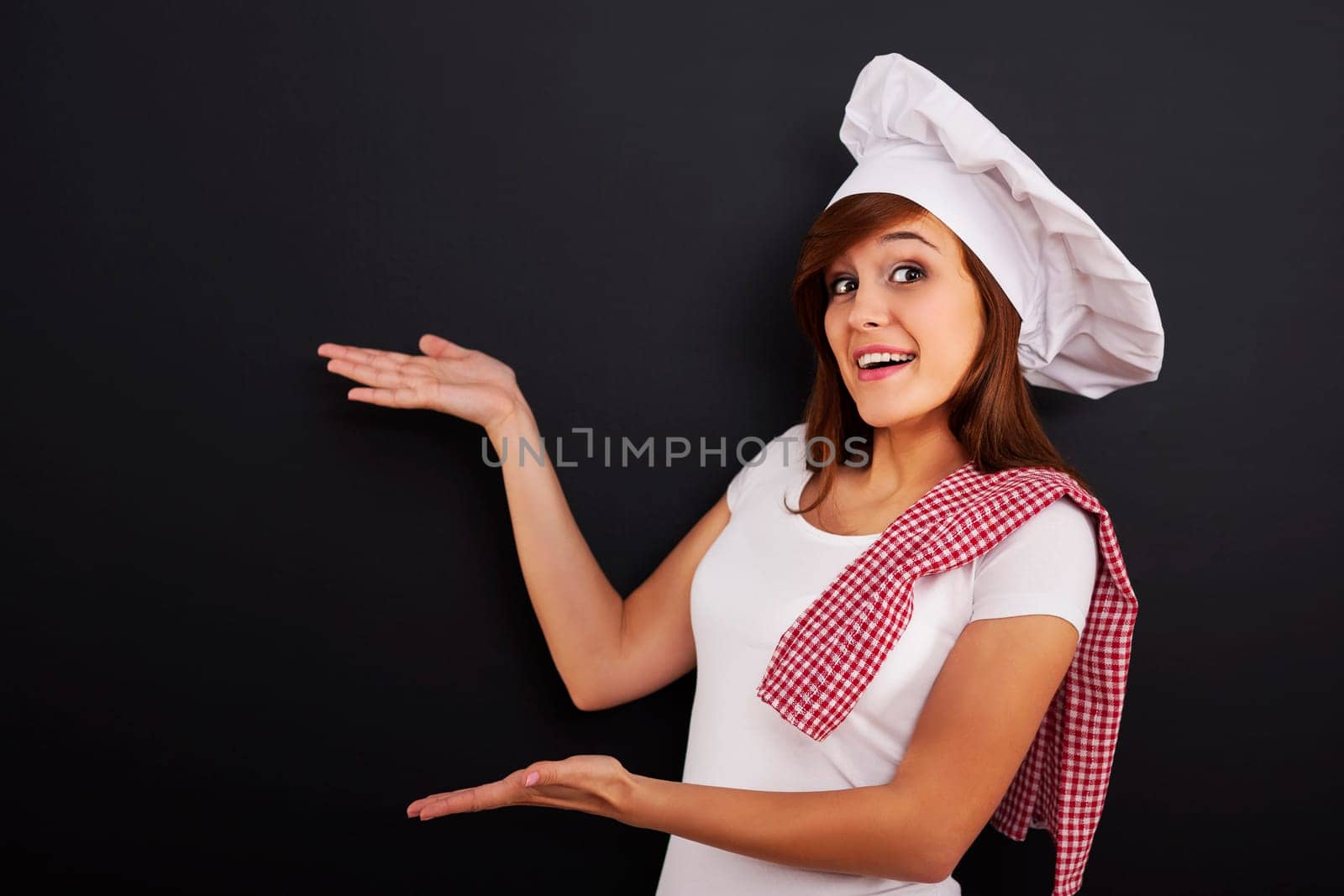 Chef showing blank menu on blackboard