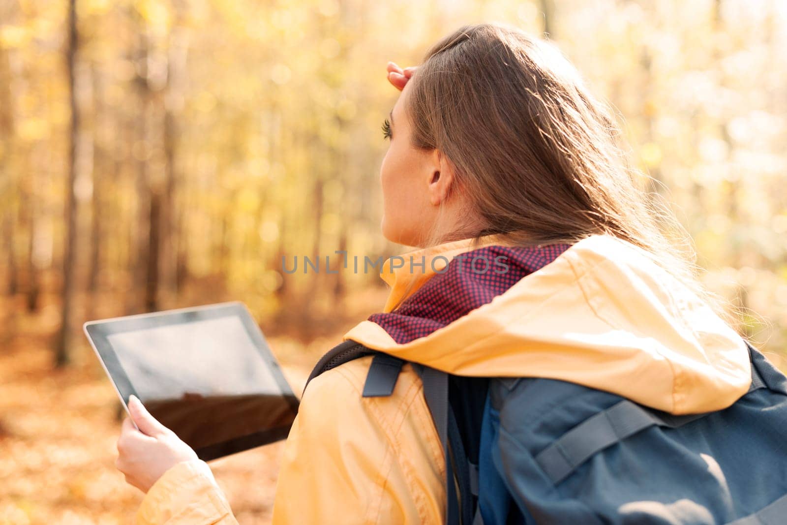 Female hiker looking for right way