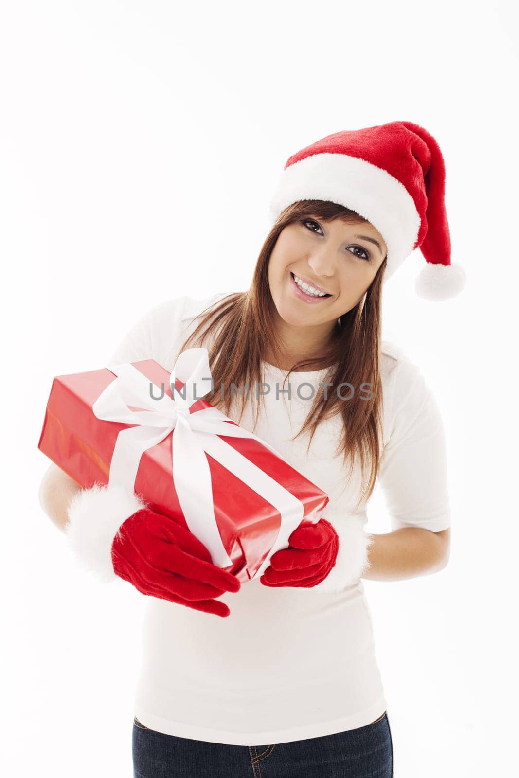 Beautiful woman with santa hat holding christmas present