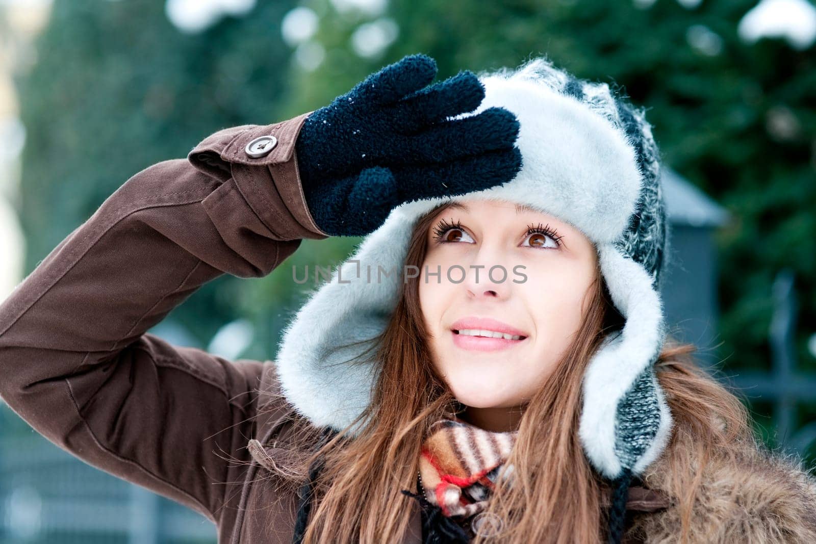 Young woman looking up