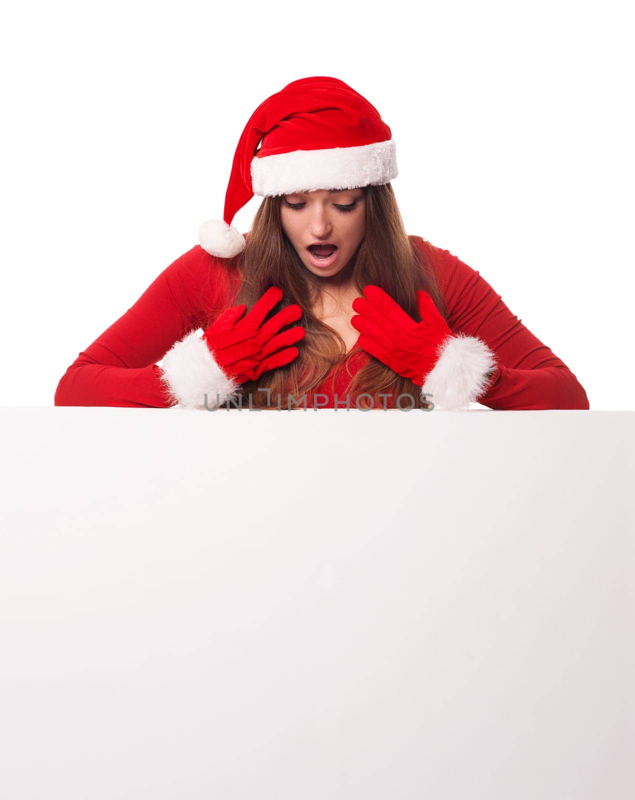 Shocked santa woman looking down on whiteboard