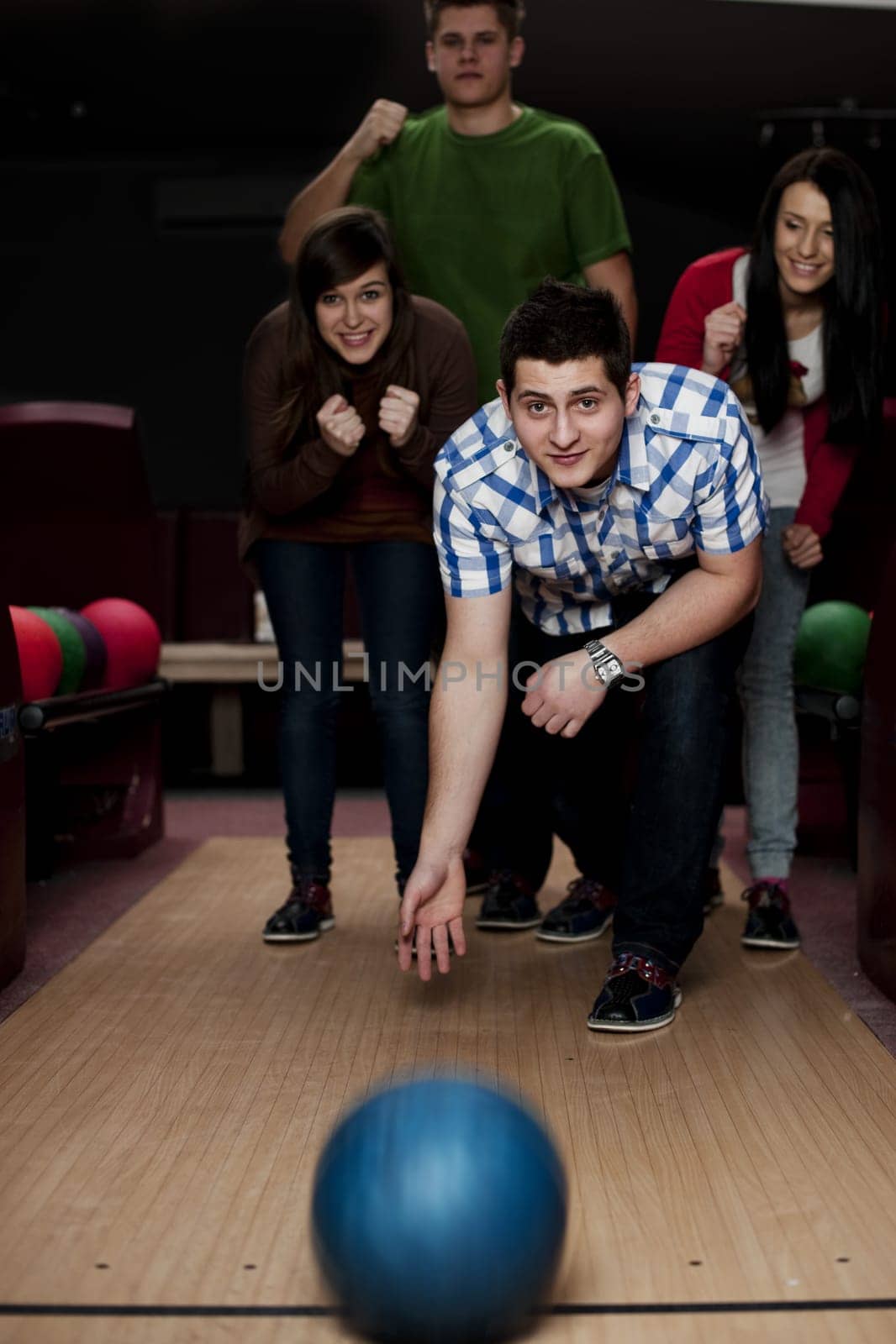 Friends bowling together