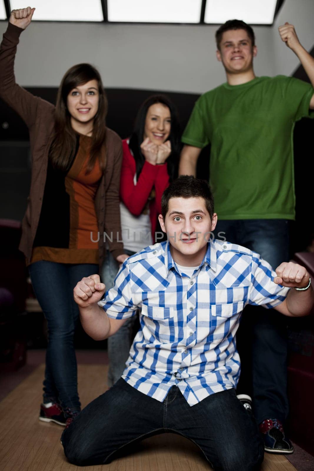 Friends bowling together
