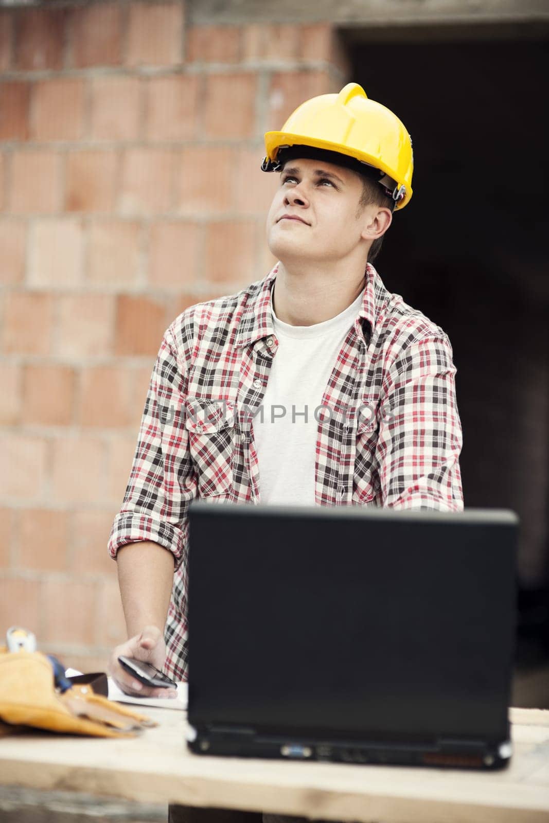 Carpenter worker with laptop