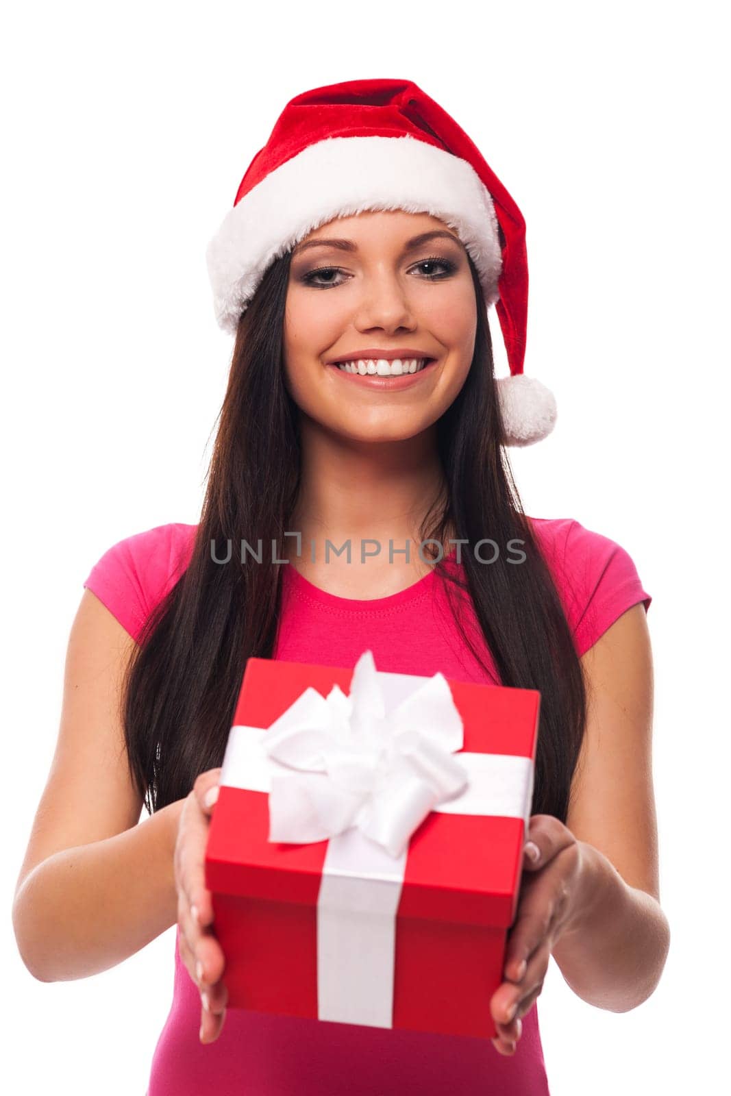 Cute woman with santa hat giving christmas gift