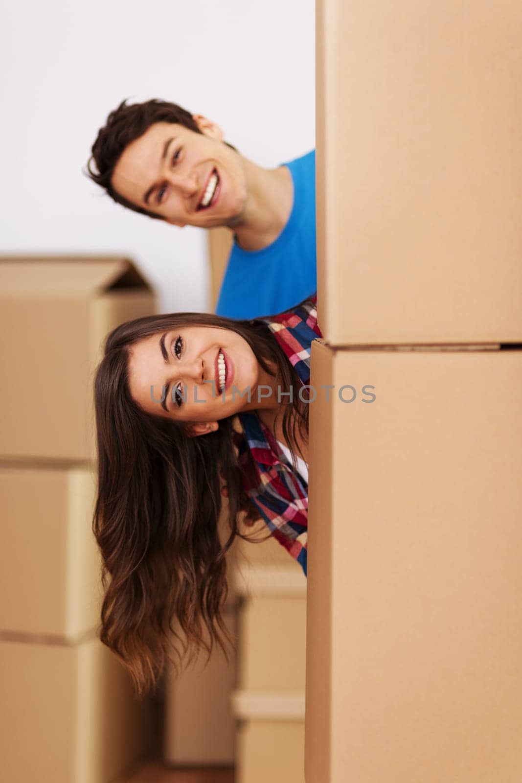 Couple having fun during  moving in new home