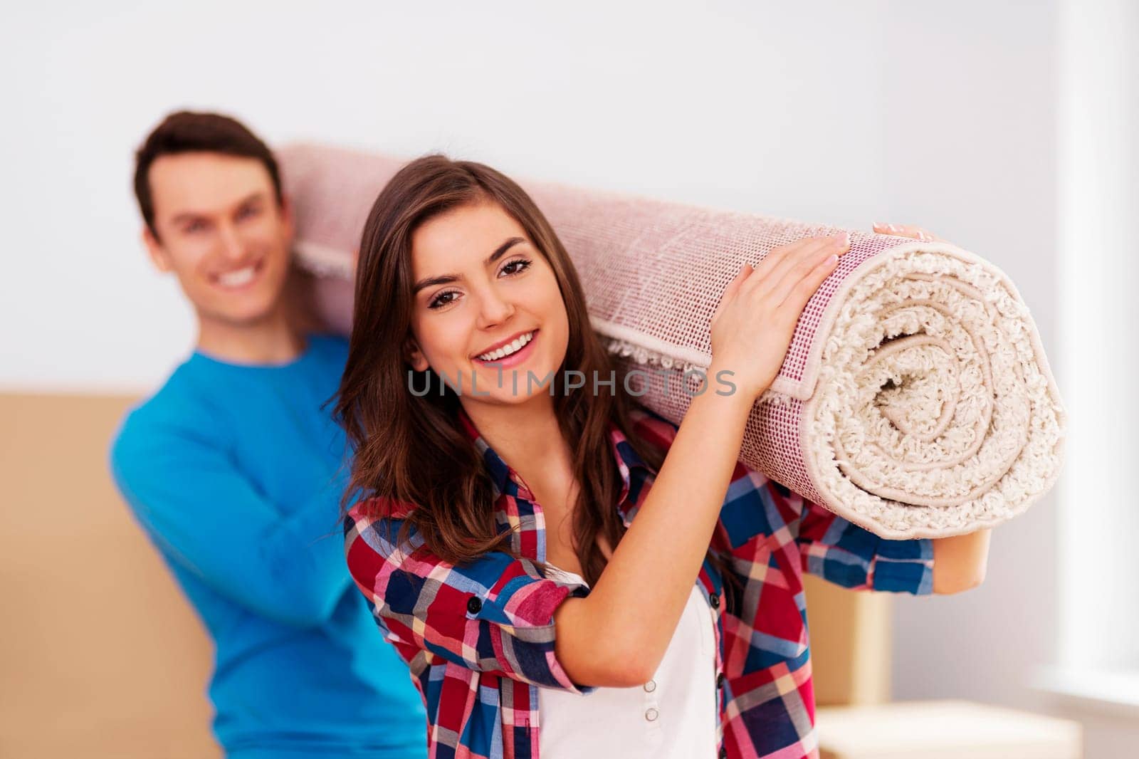 Young couple moving in to new house