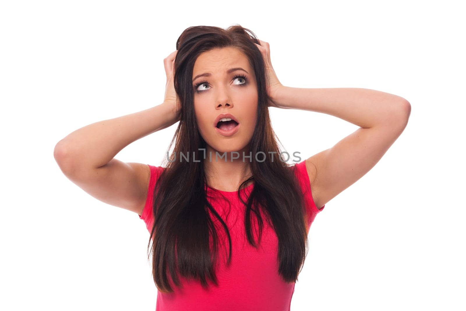 Young woman looking surprised on white background