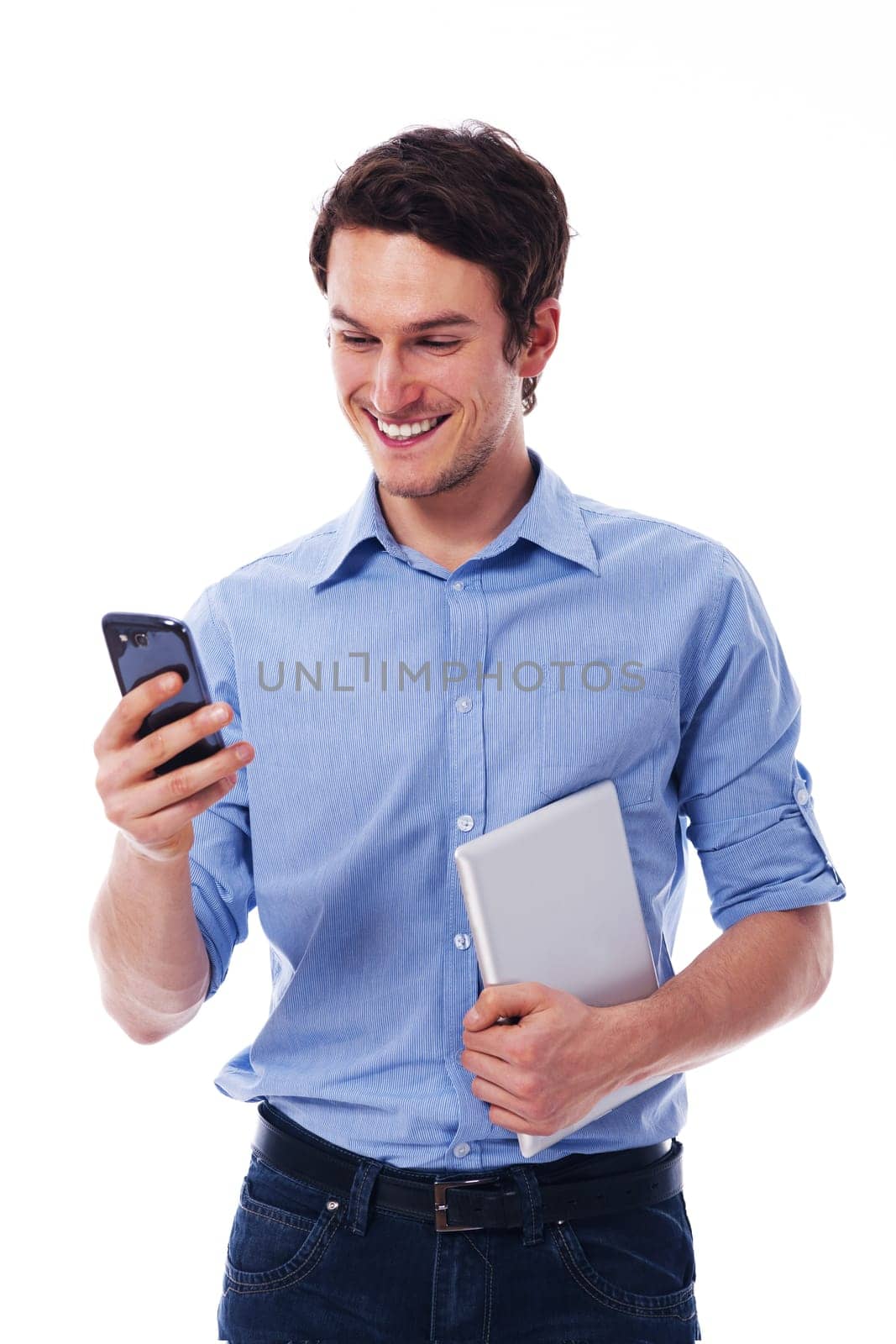 Smiling man using wireless devices