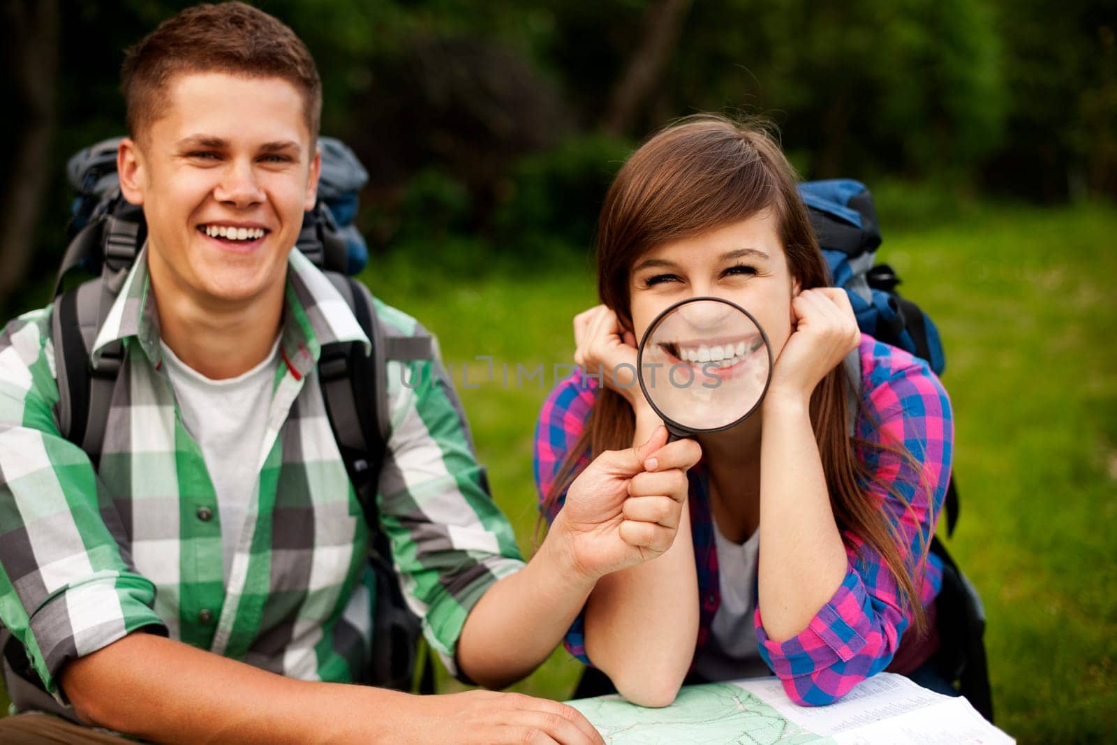 Young couple with map in forest