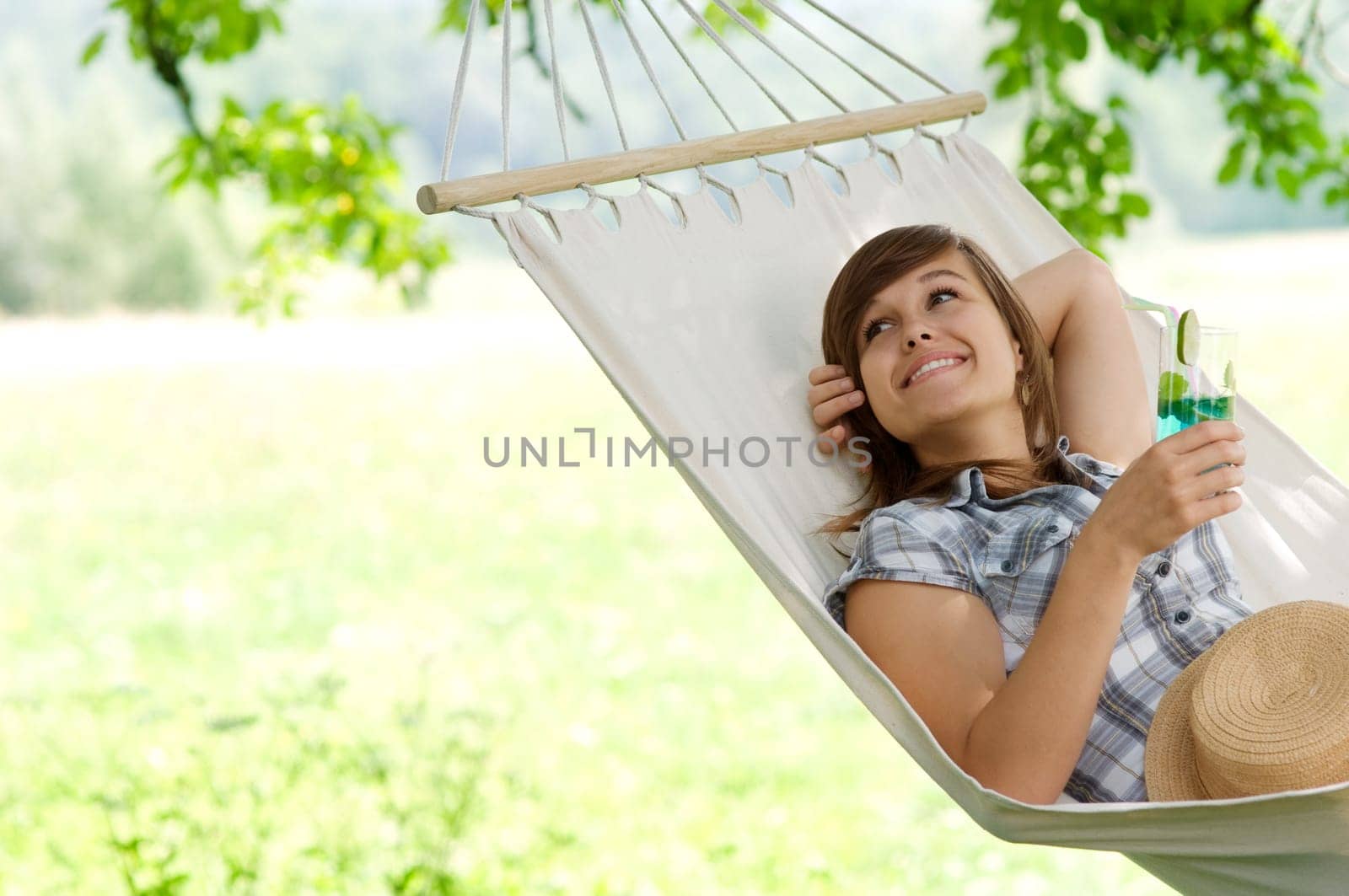 Young woman resting on hammock
