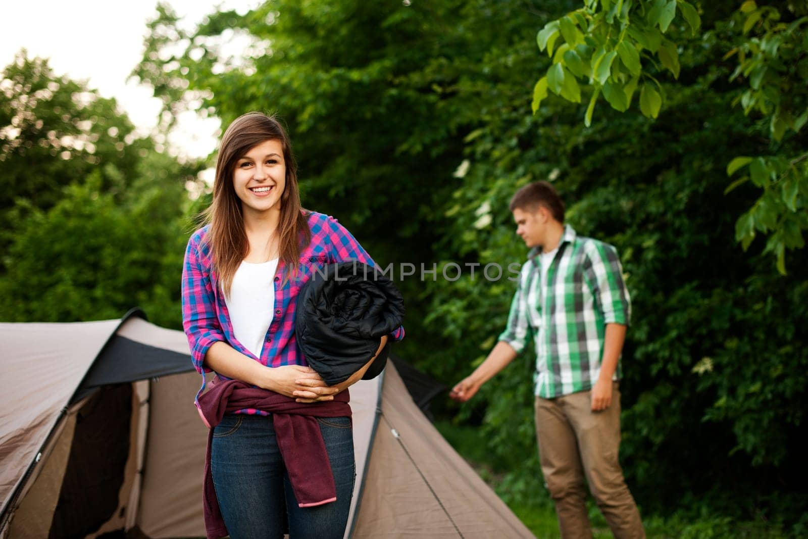 Young woman with sleeping bag