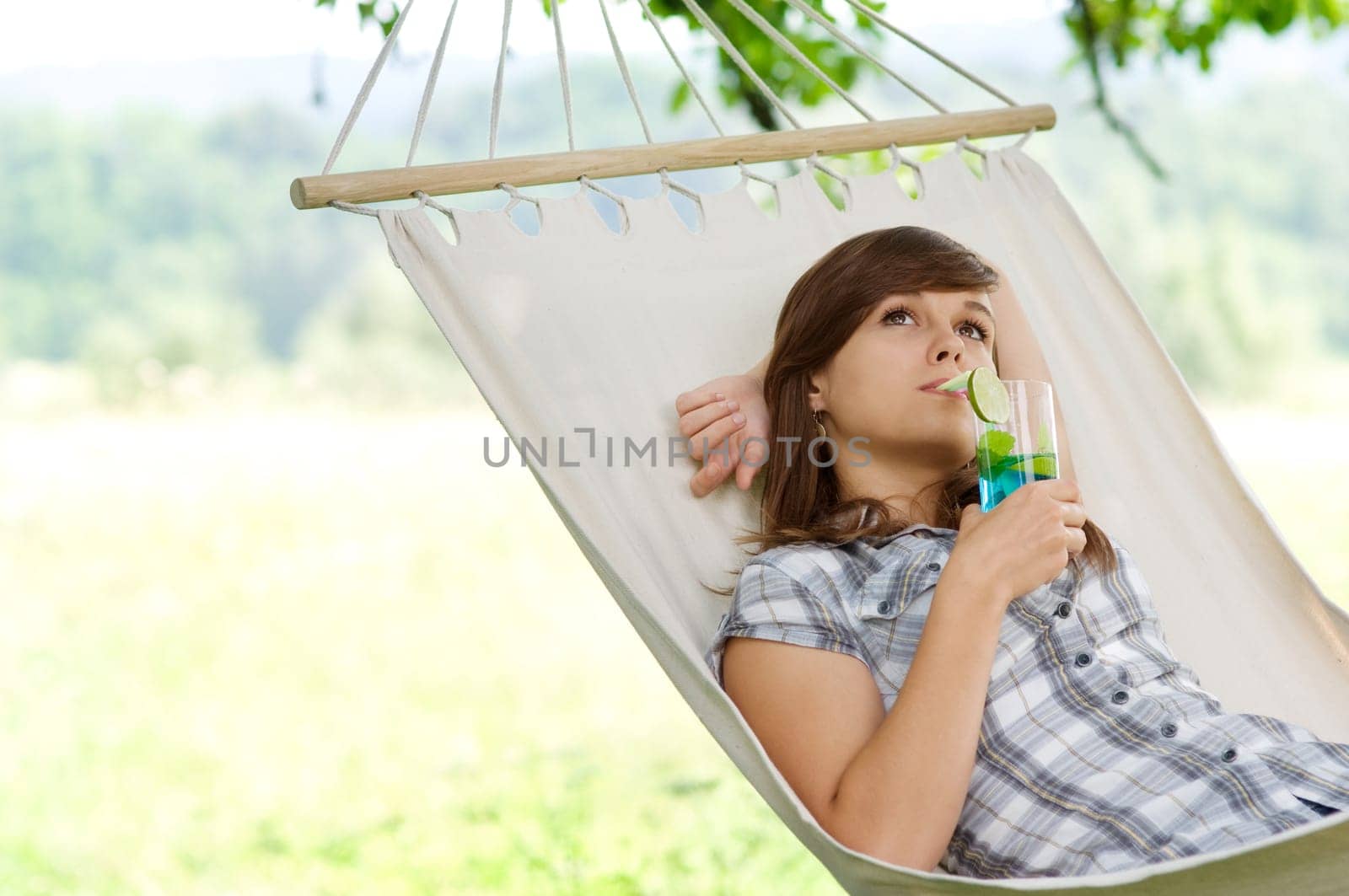 Young woman resting in hammock