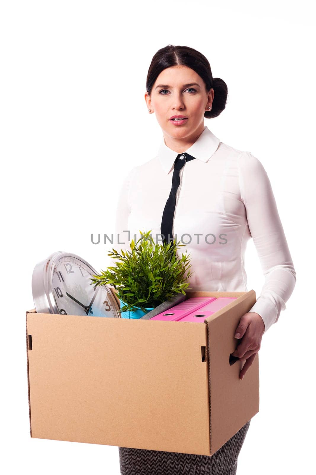 Businesswoman holding a box of personal items