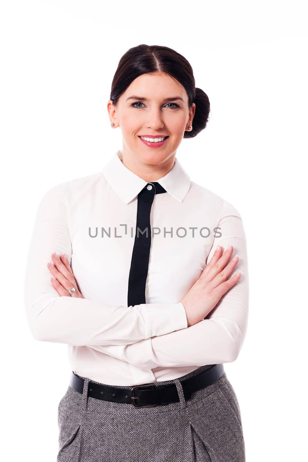Smiling businesswoman with arms crossed
