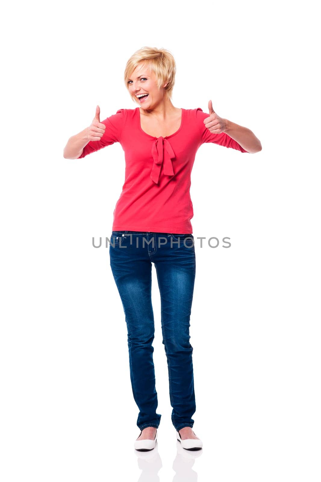 Beautiful blonde woman showing thumbs up