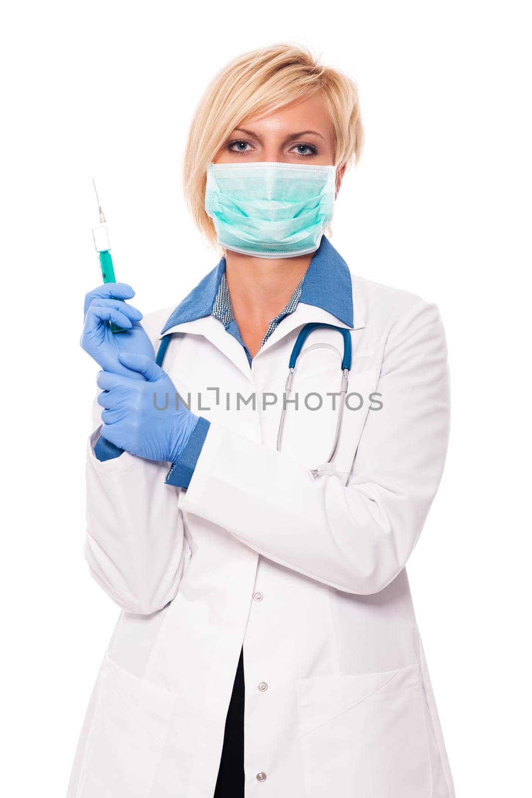 Blonde female doctor holding syringe