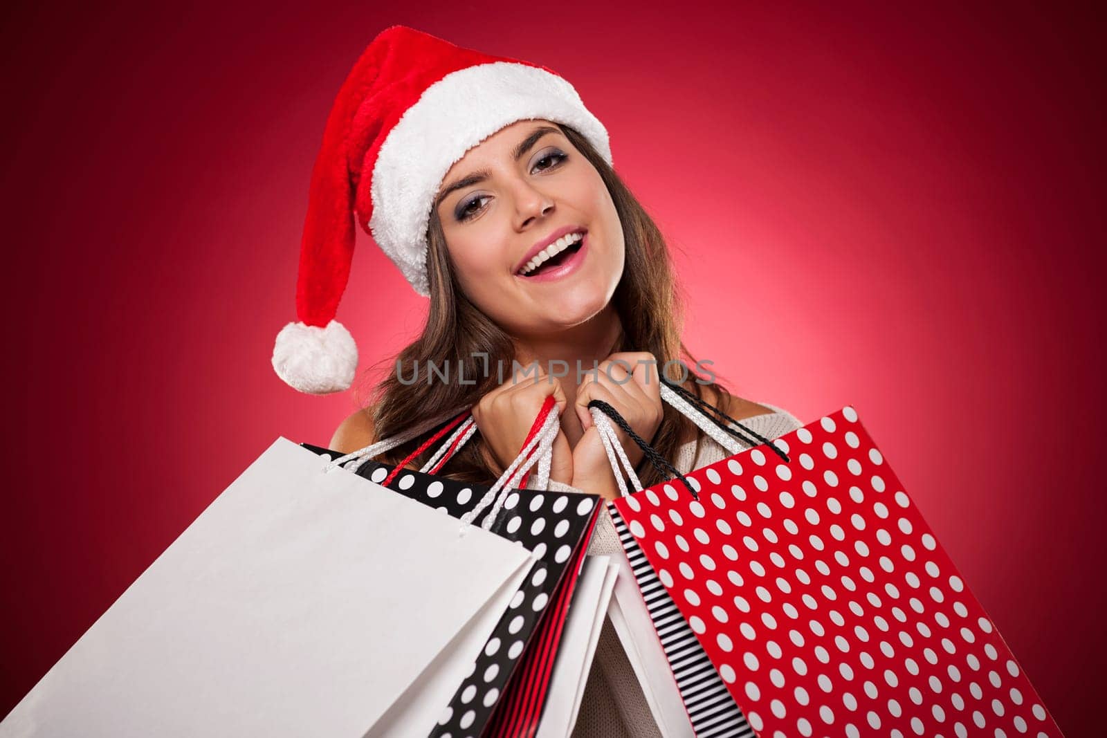 Smiling woman with christmas shopping