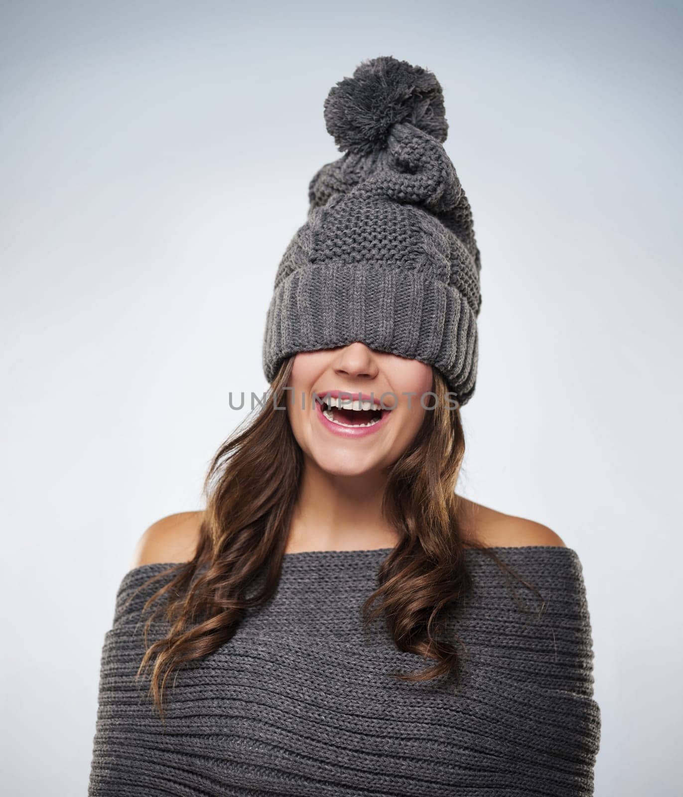 Young woman have fun with wool clothes