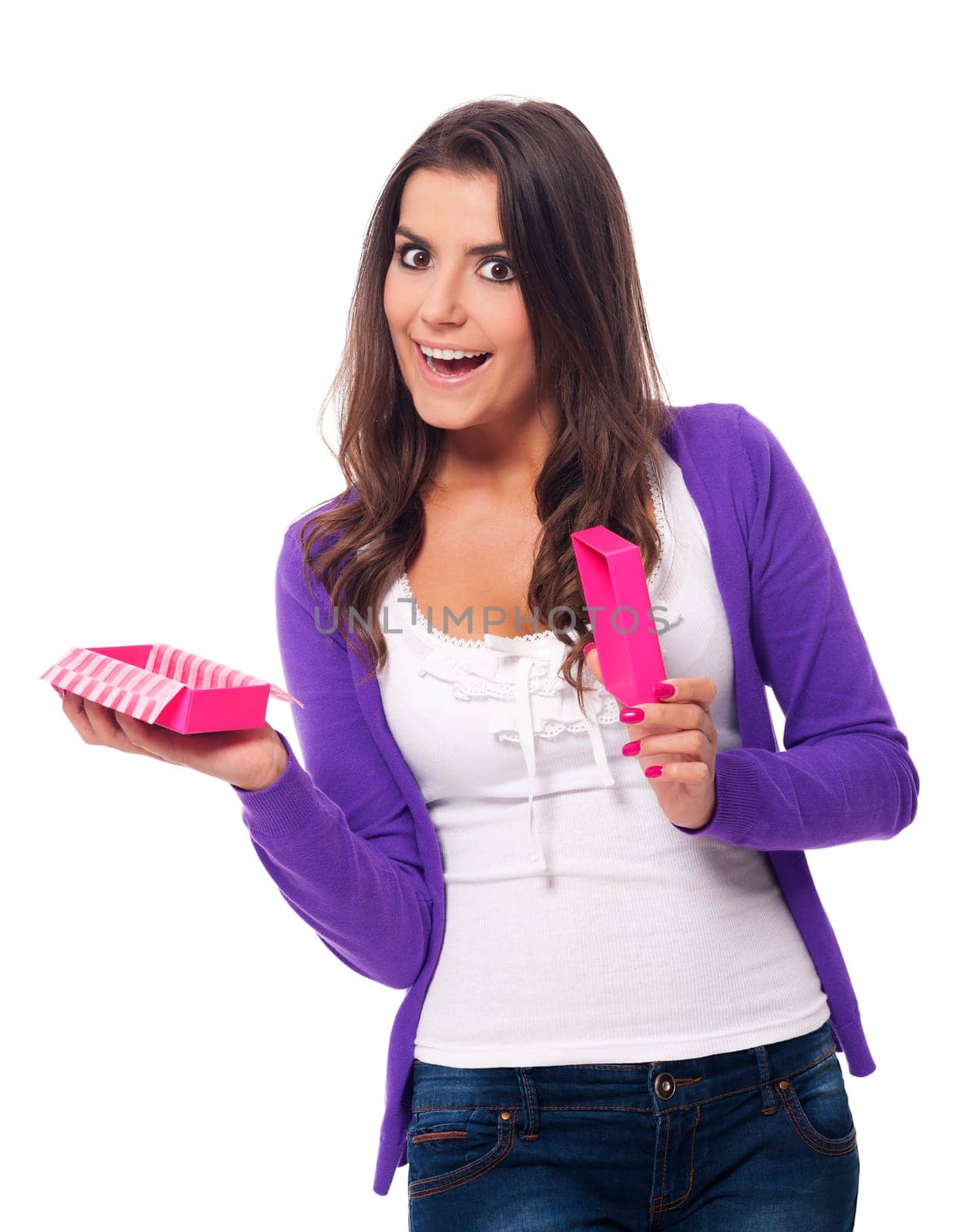 Surprised woman opening small pink gift