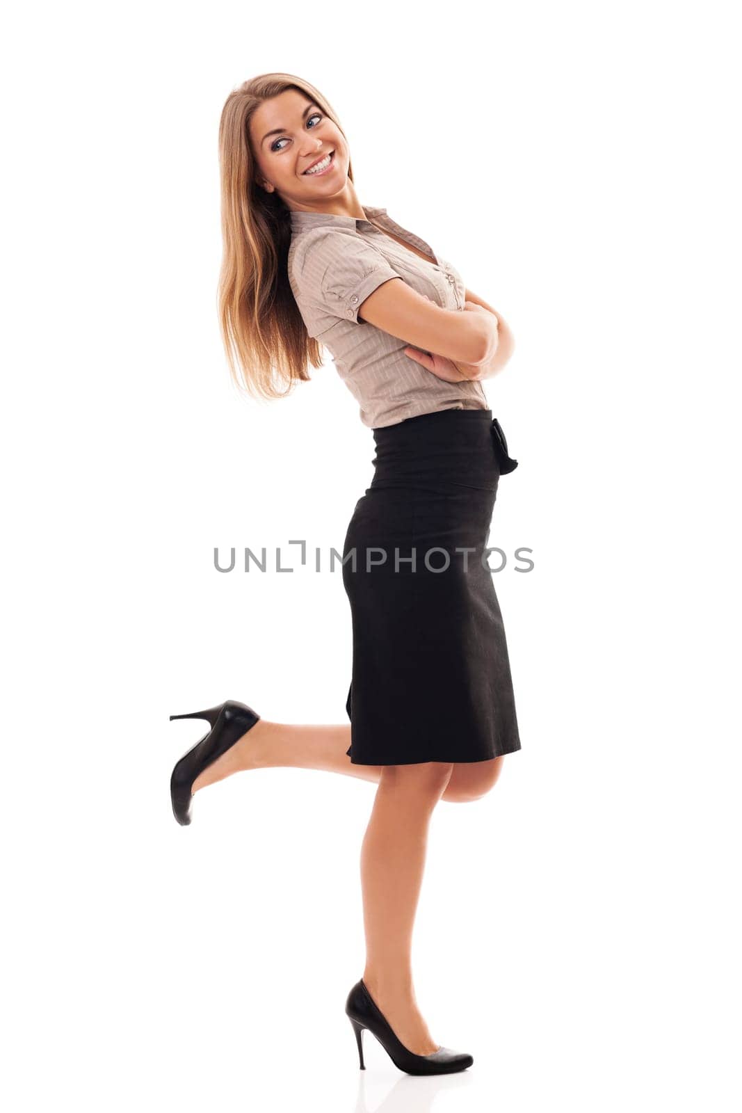 Successful businesswoman kicking up foot