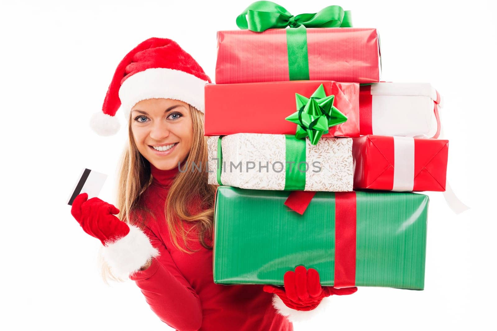 Beautiful woman holding christmas presents and credit card