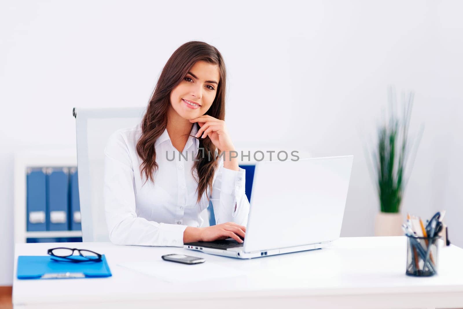 Beautiful woman working at office