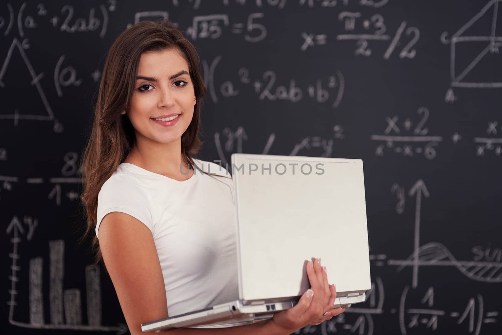 Female student with laptop in her hands