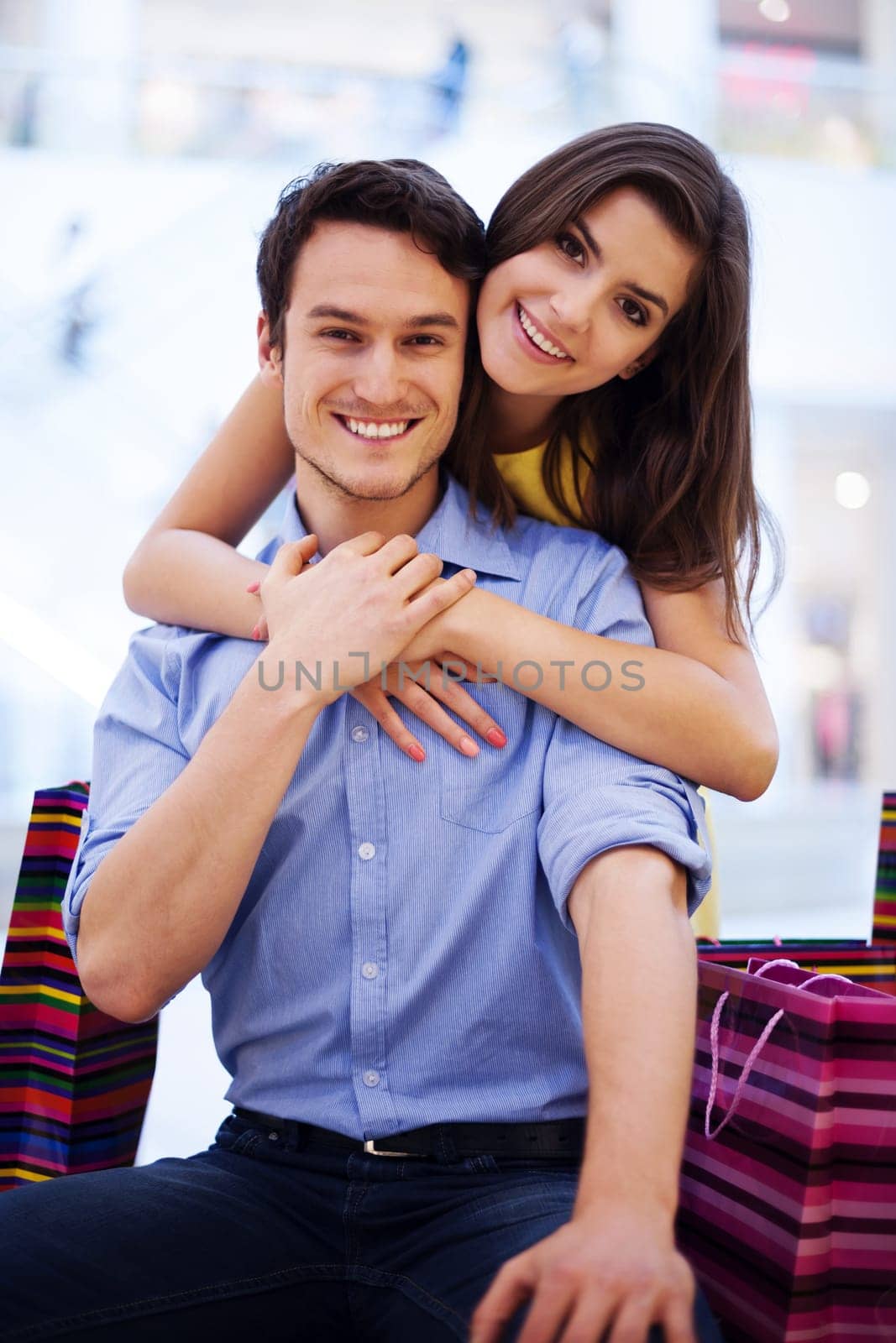 Smiling couple in the shopping mall