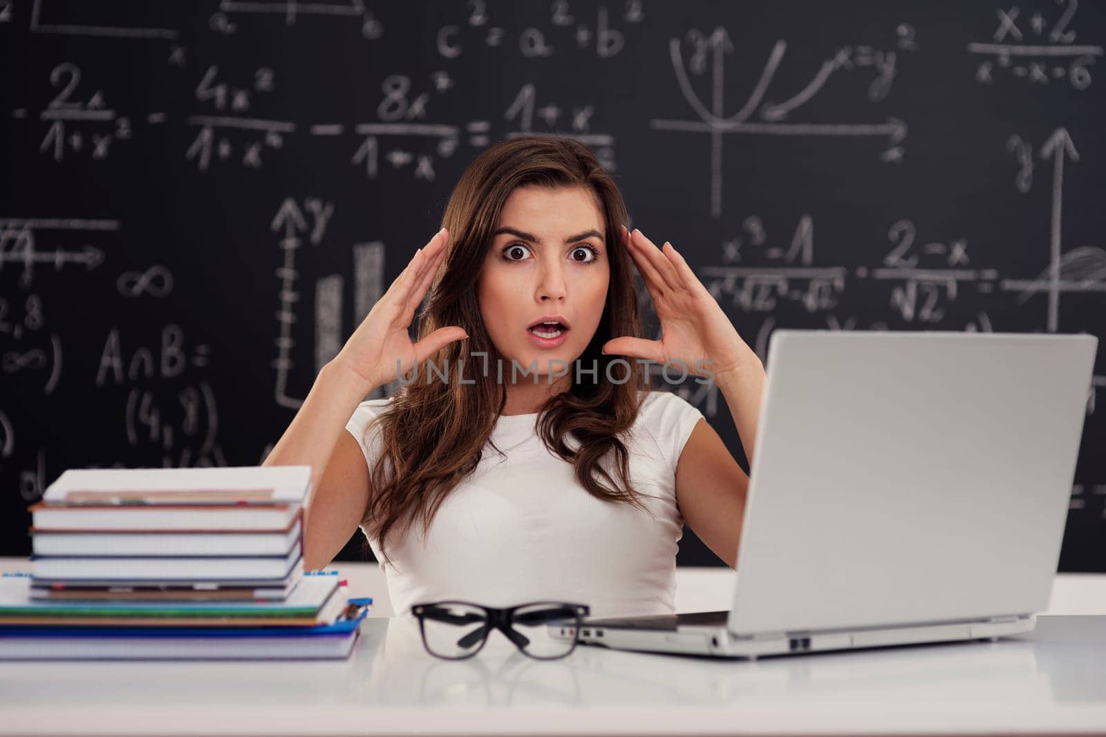 Terrified young woman in classroom