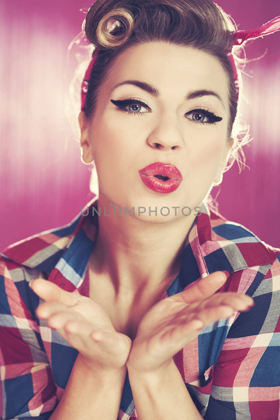 Pin-up girl blowing a kiss