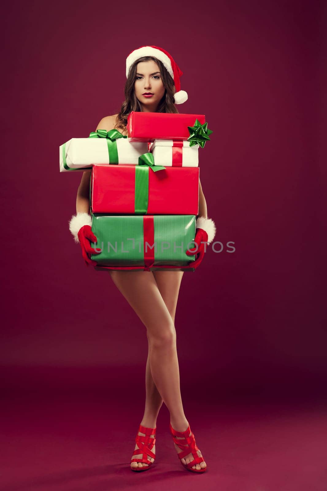 Sexy naked santa with christmas present