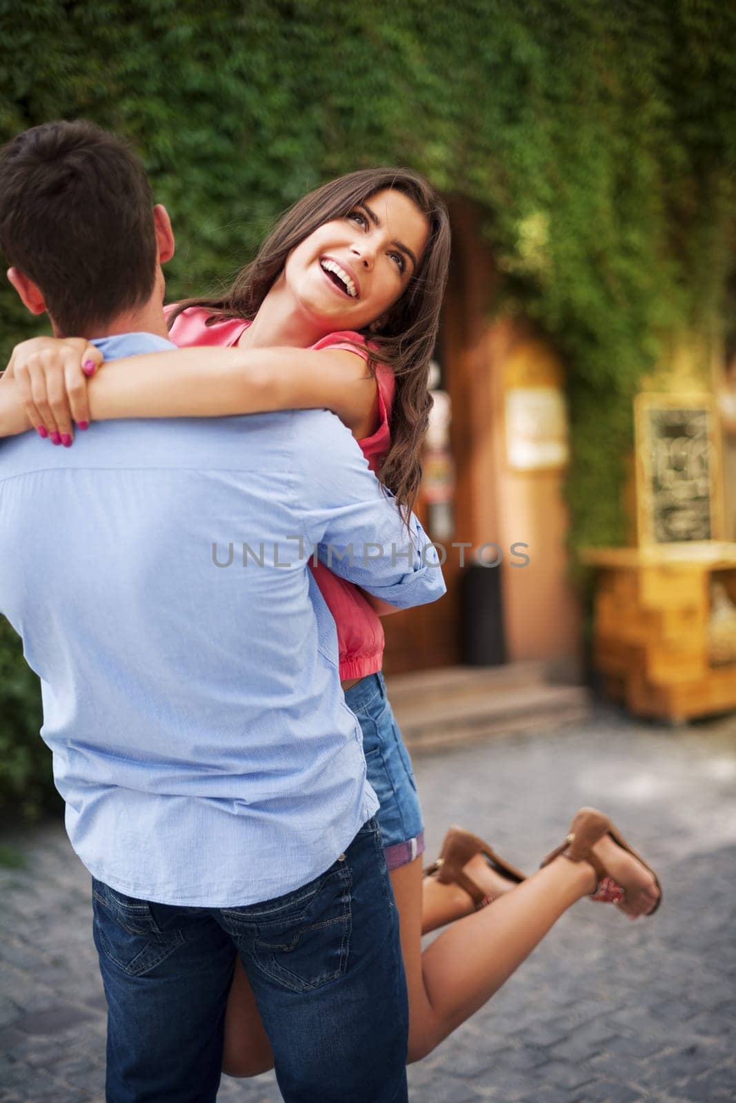 Young couple hugging on the city road