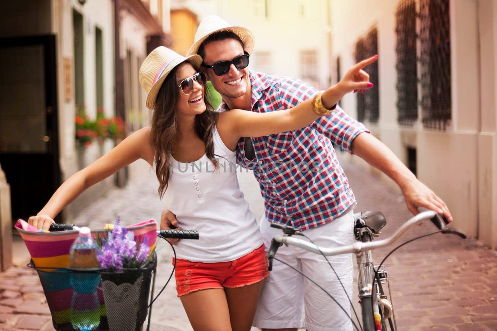 Happy couple with bikes in the city