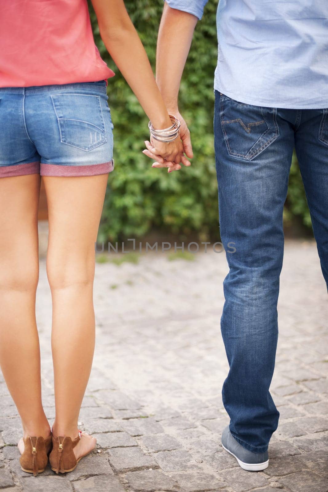 Part of couple with holding hands