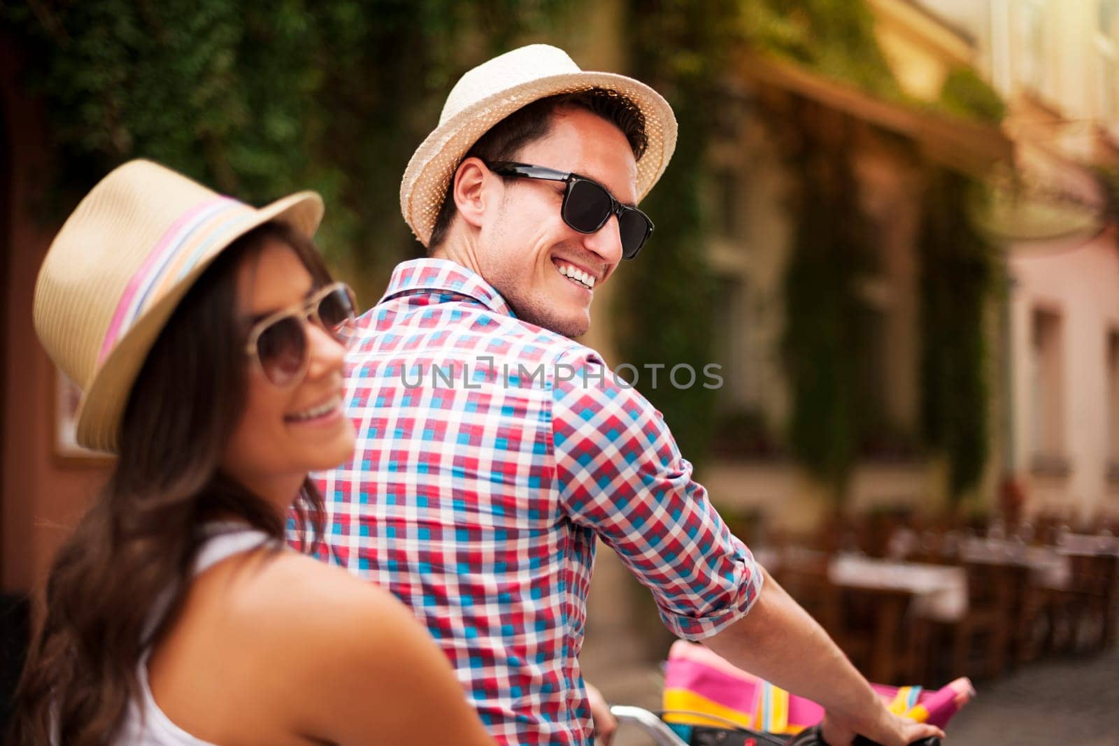 Beautiful couple on bicycle in the city