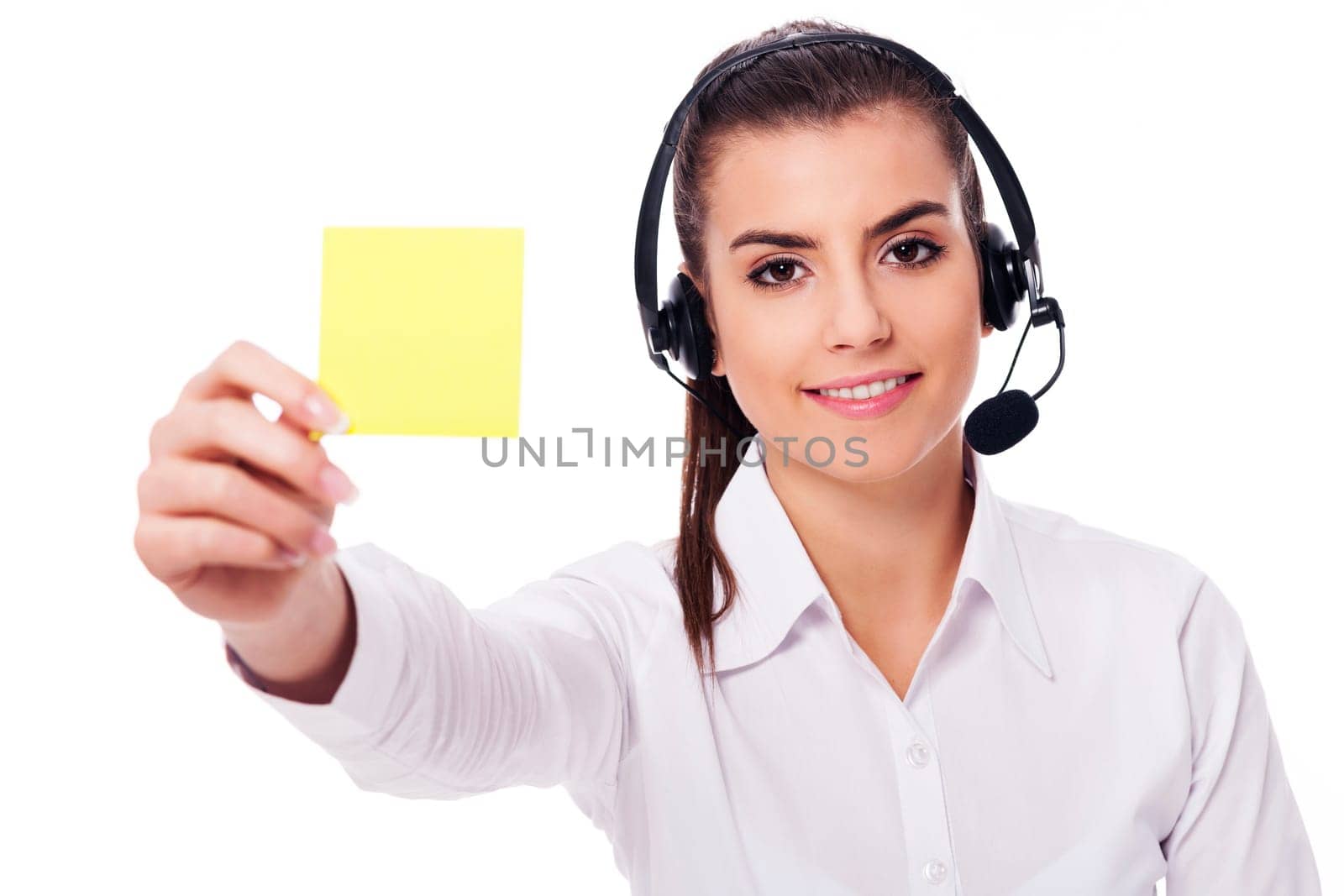Female operator holding yellow note