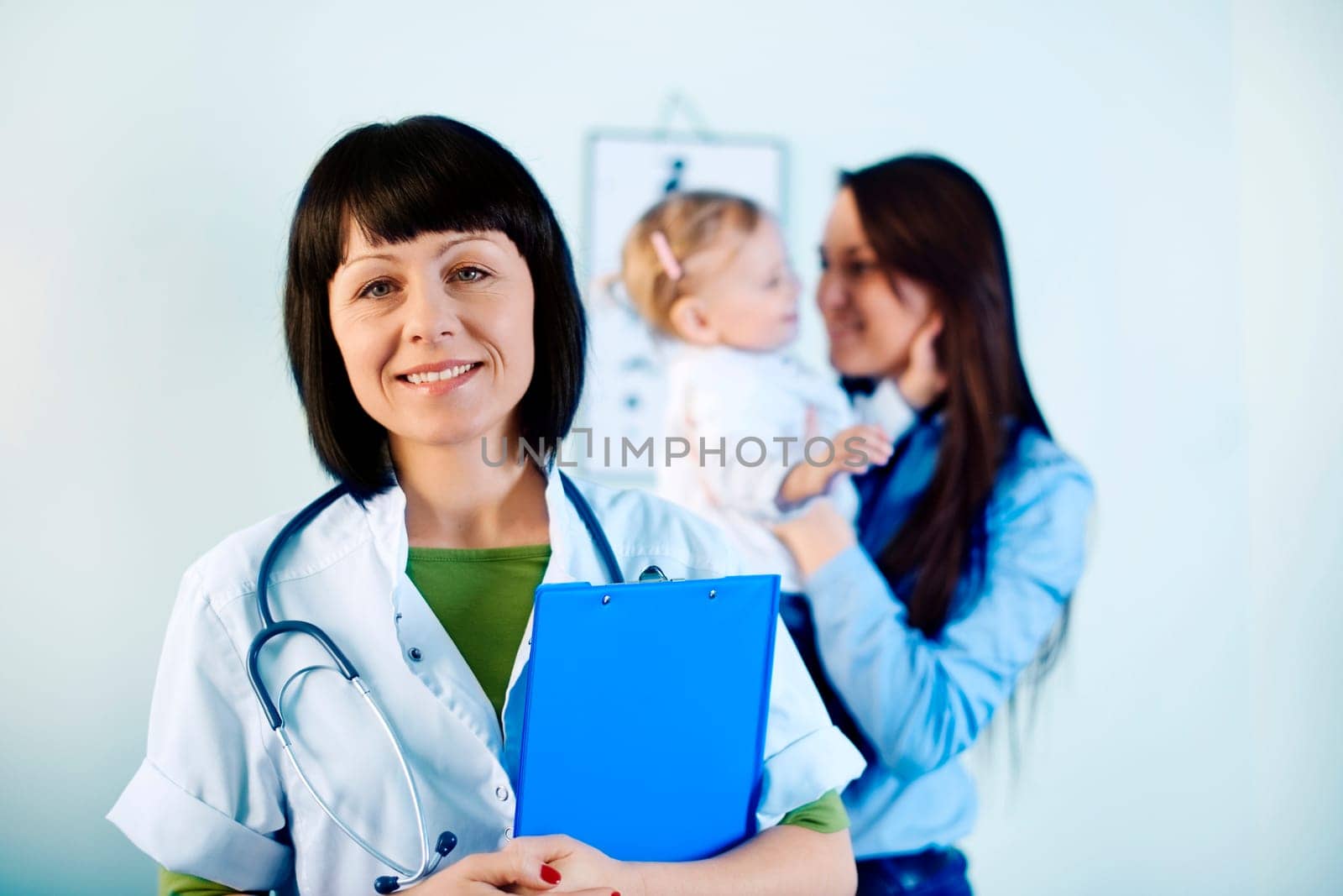 Smiling doctor holding notes