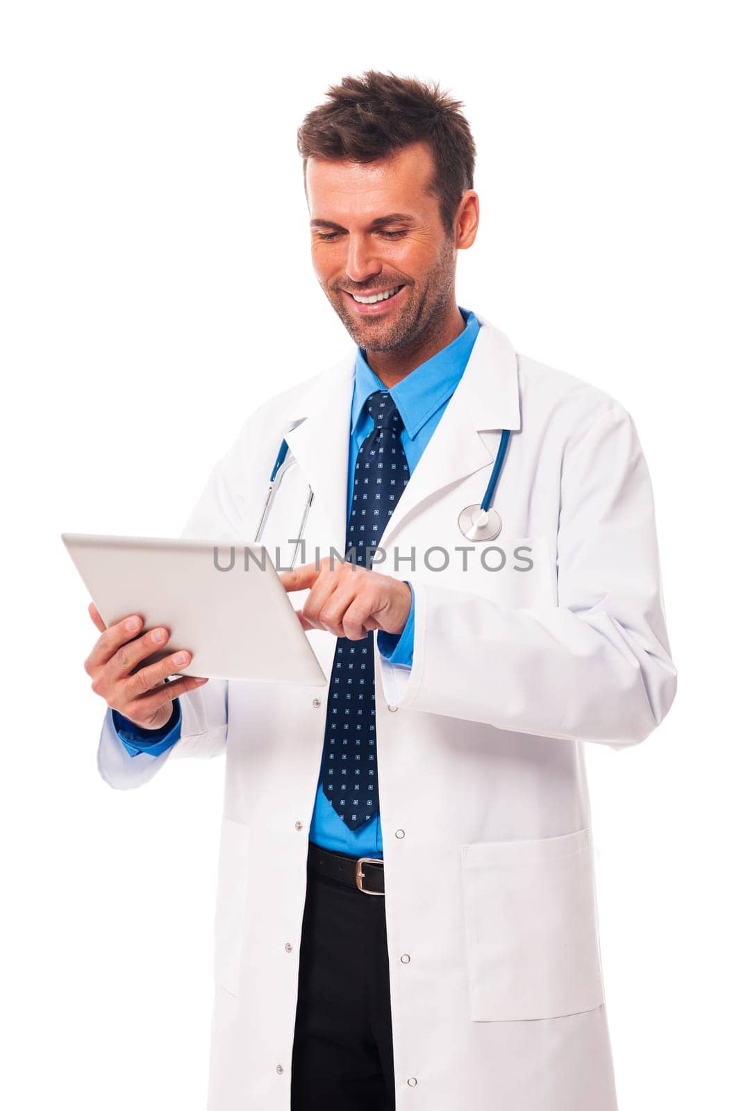 Male doctor working on digital tablet