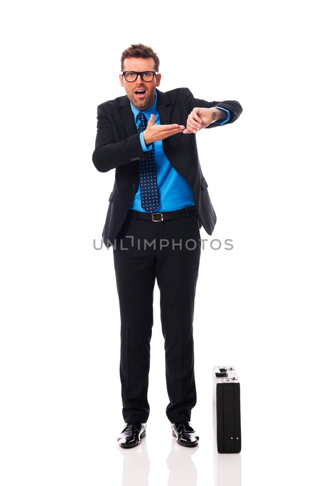 Angry businessman waiting for late business partner