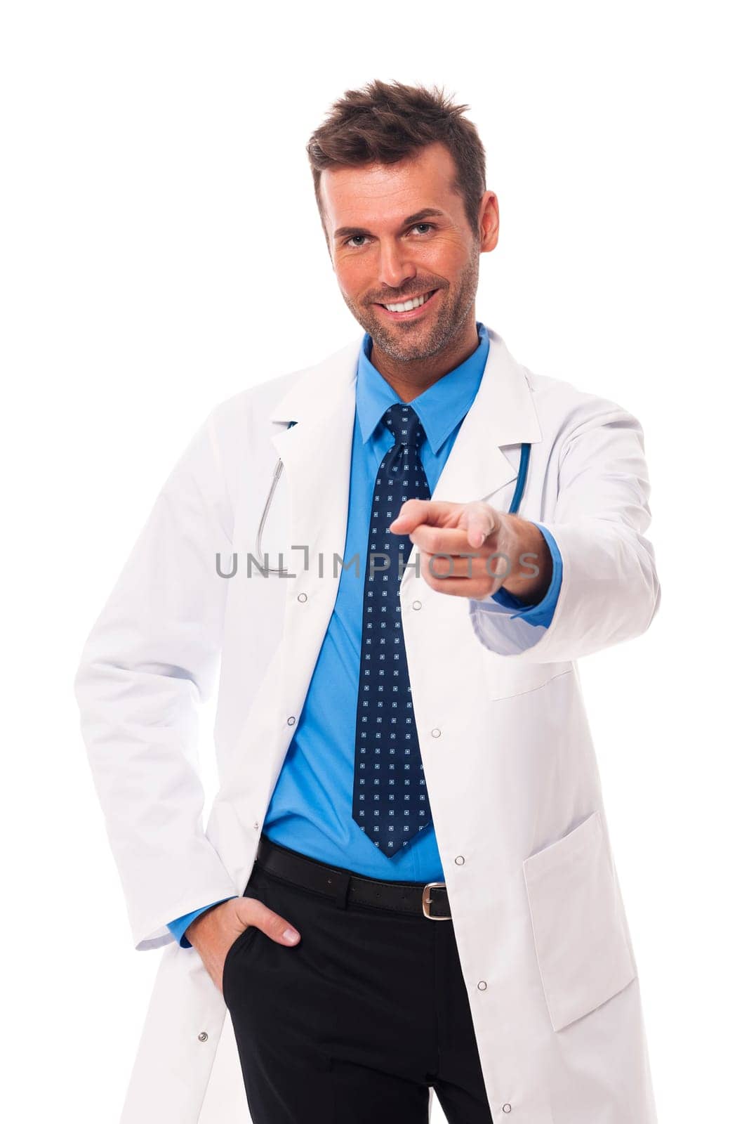 Handsome and smiling doctor pointing at camera side